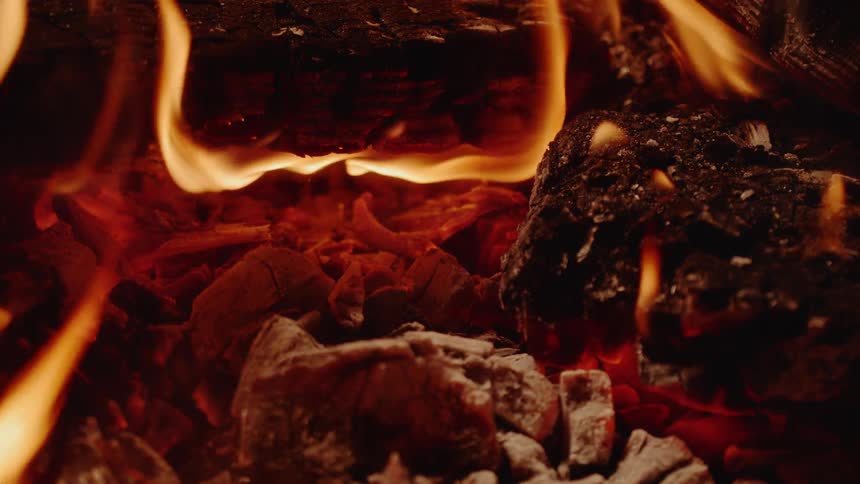 A fire burns pieces of wood