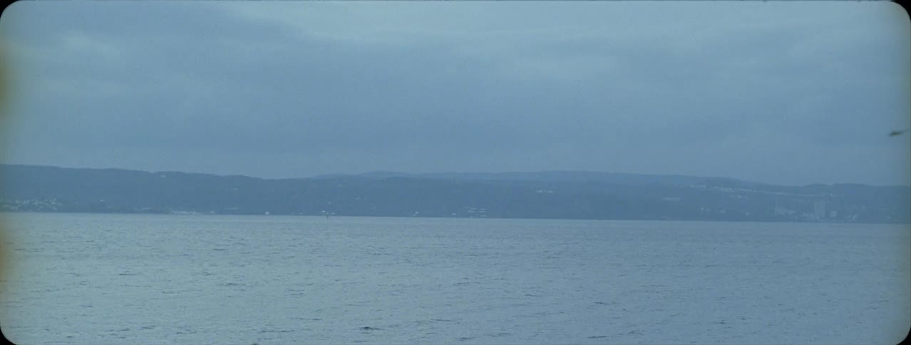 The lake sits under the cloudy sky