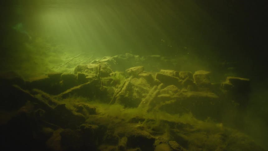 Sunlight shines through a lake surface
