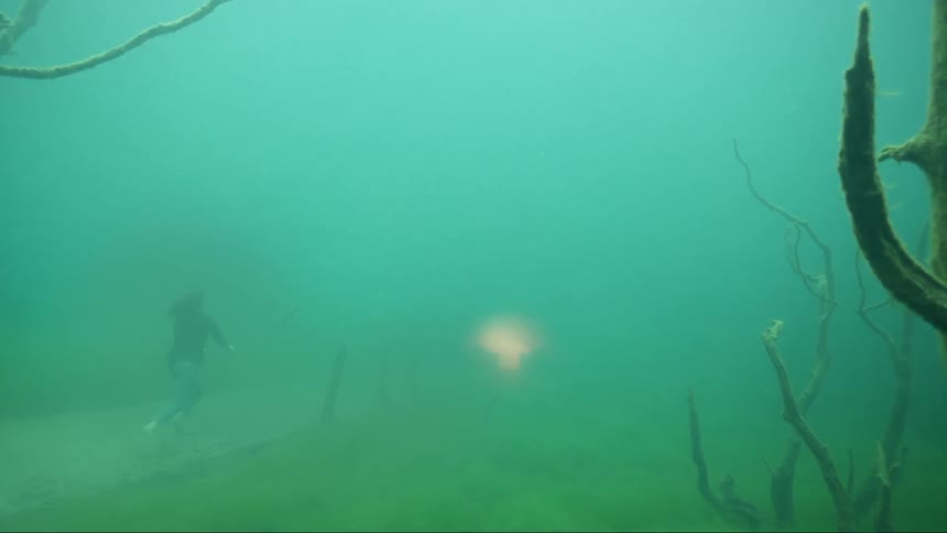 Woman walking under water