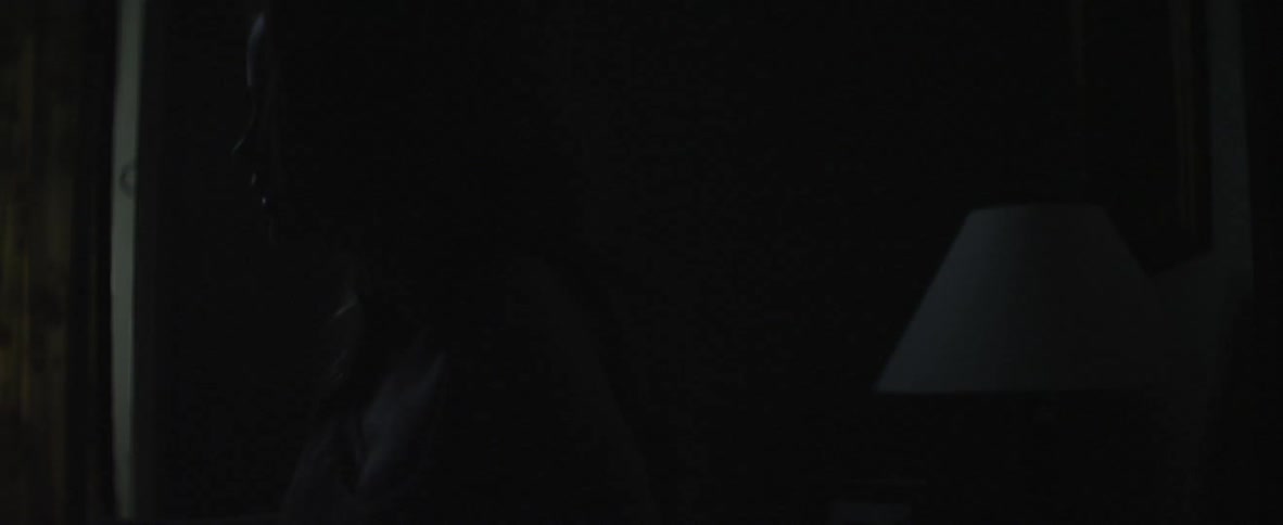 Woman lying in bed at night