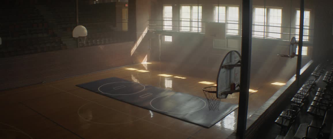 The basketball court is empty on a sunny day
