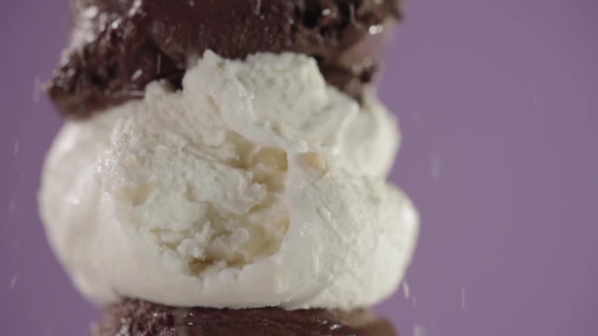 Nuts are poured on an ice cream cone