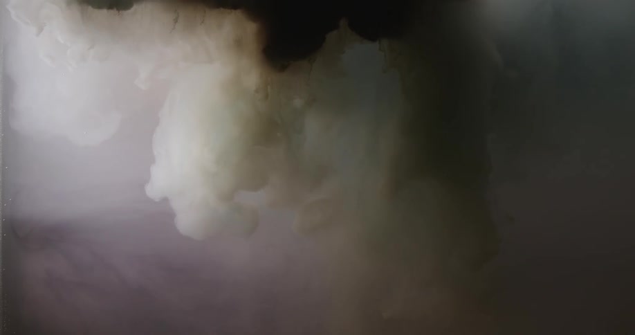 Slow motion of white and black ink descending in water
