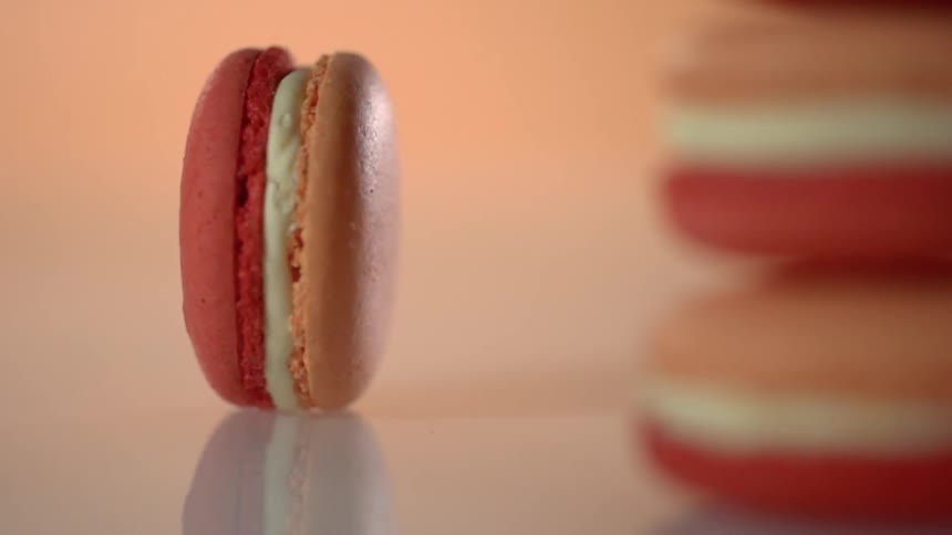 A macaroon rotates on its edge