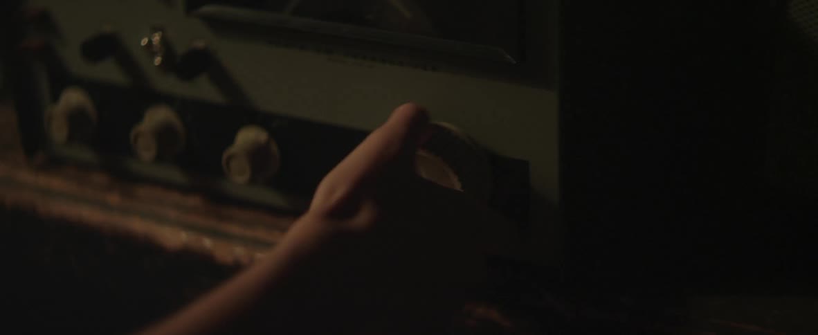 A woman turning a dial