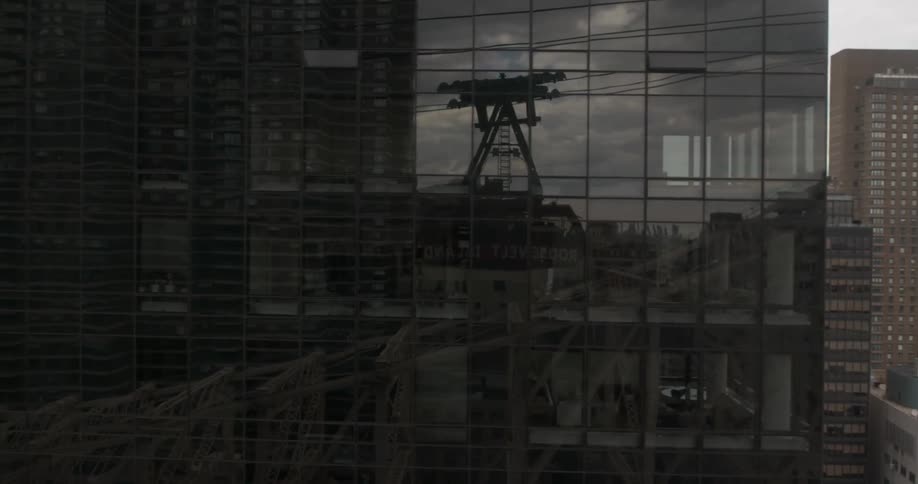 Reflection of buildings in a large skyscraper