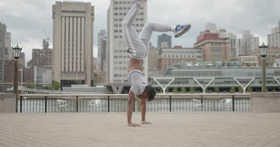 A man jumps around on his hands