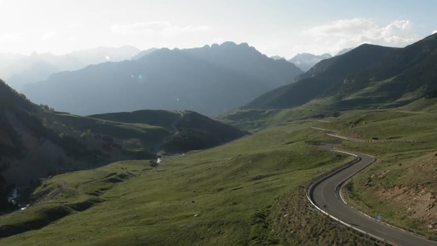 The green fields have a road over the top