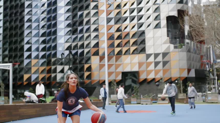 People play basketball together in the park