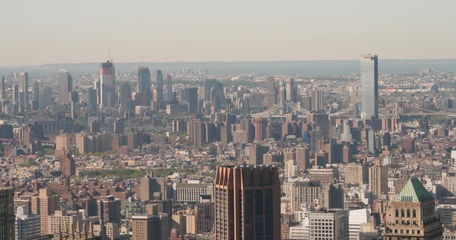 The city is covered with a light fog below
