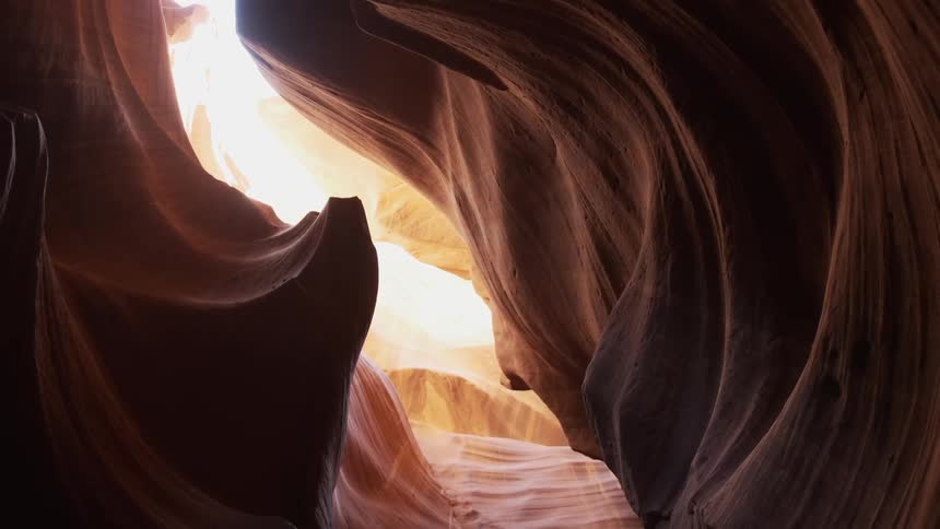 Sun shines down into a rocky cave