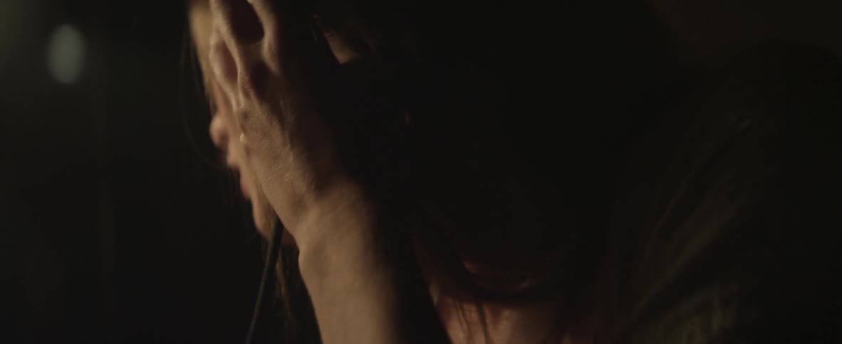 A woman puts on a headset