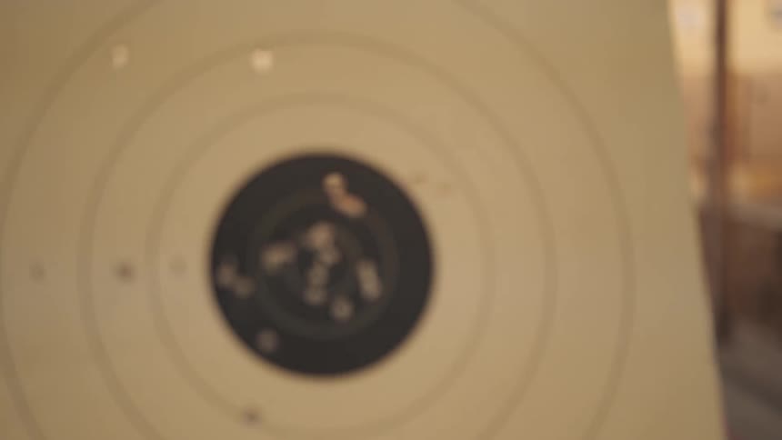 A mechanism brings a shot paper target forward