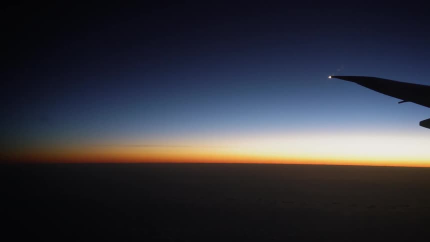 Airplane wing and a sunset