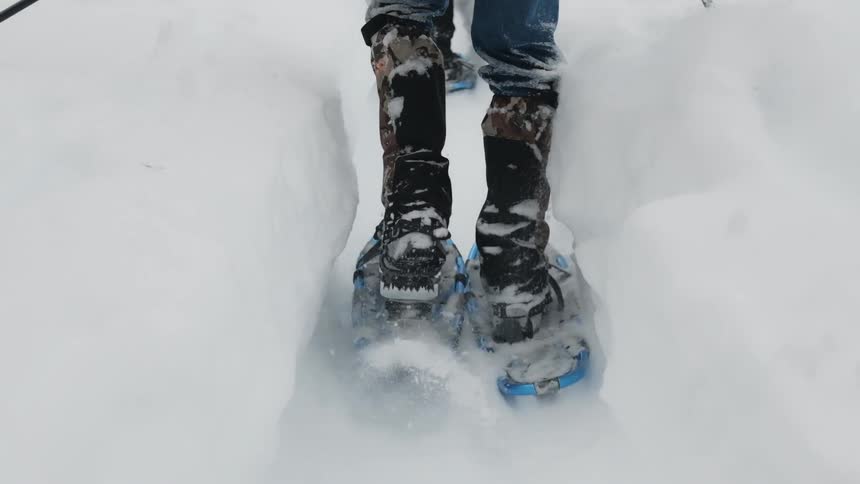 A person is traveling through the deep snow