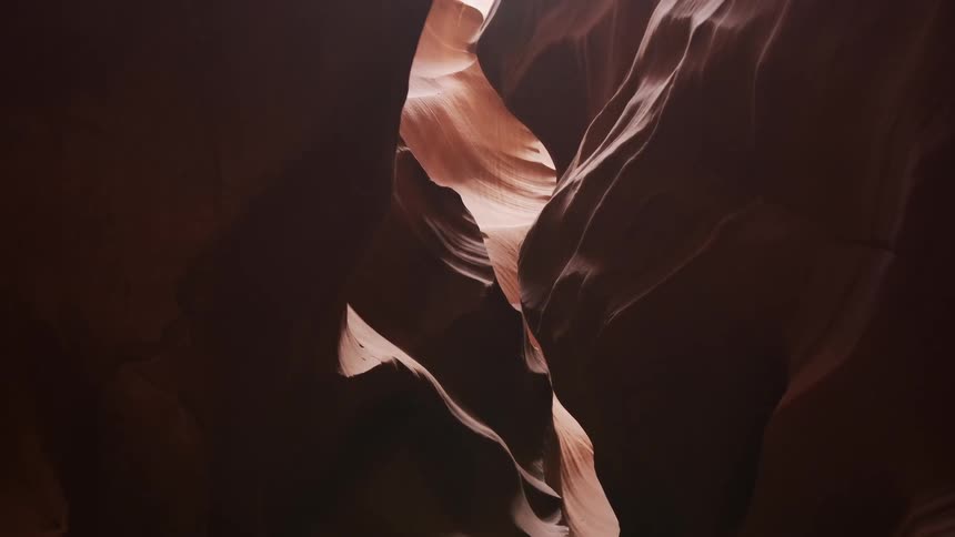 The dark cave has shadows covering all over