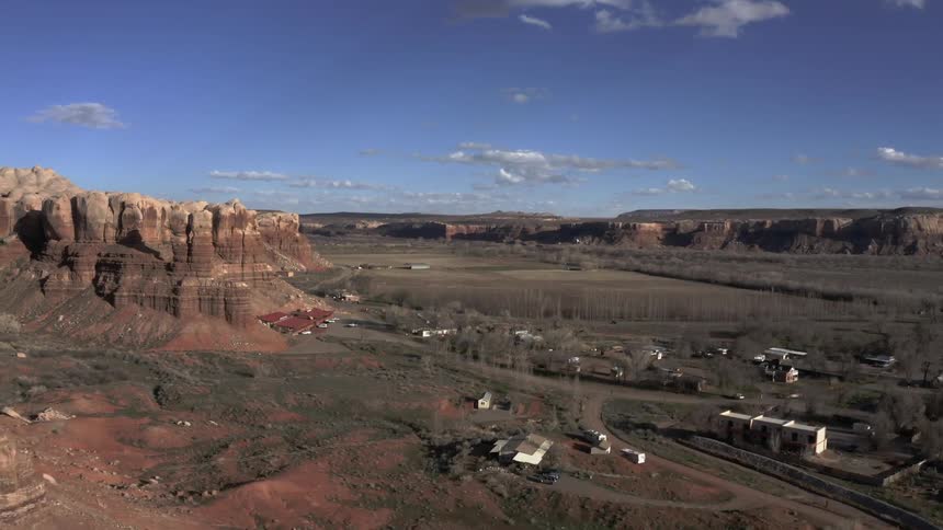 Desert town surrounded by large rock formations