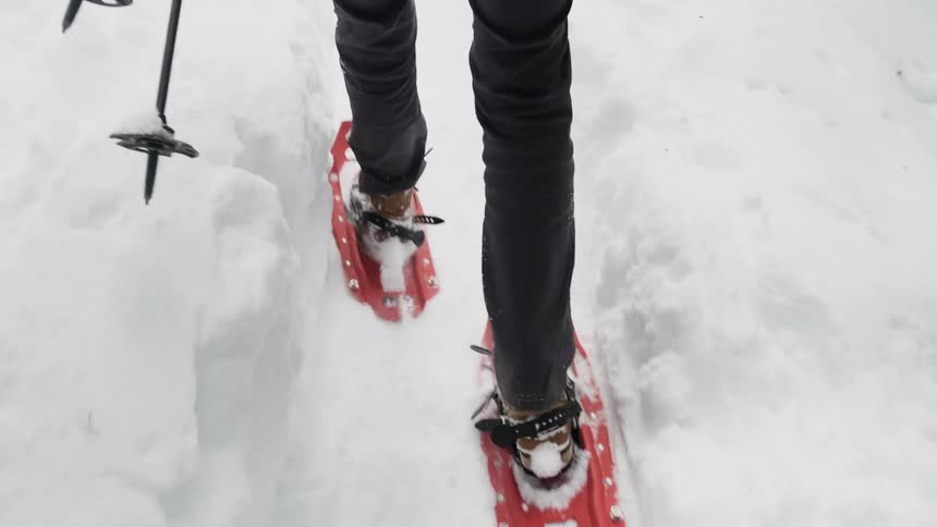 Walking through deep snow with snowshoes