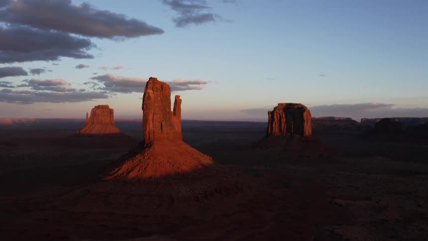 Desert rock formations illuminated at dusk