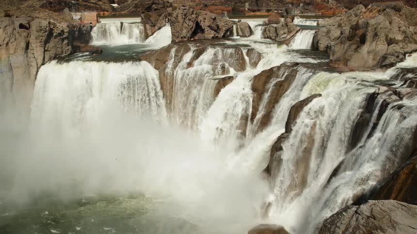 Waterfalls flow over a cliff