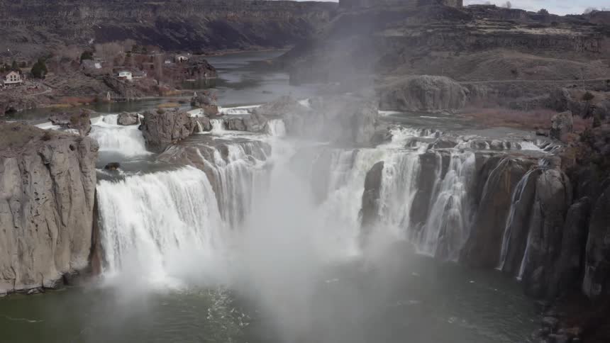 Waterfalls flow over a cliff