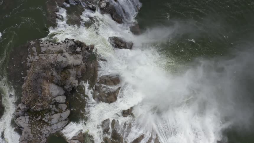 Waterfalls flow over a cliff