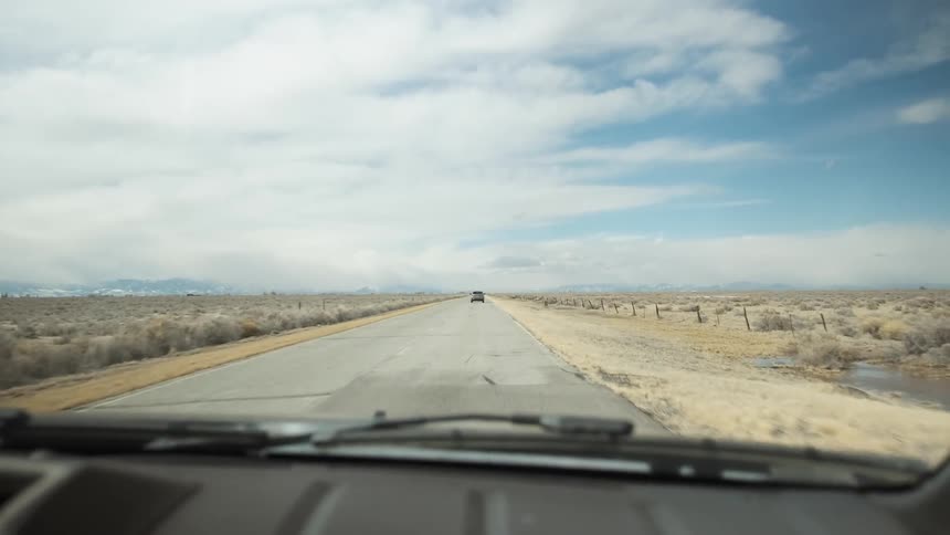 Vehicles travel on a rural road