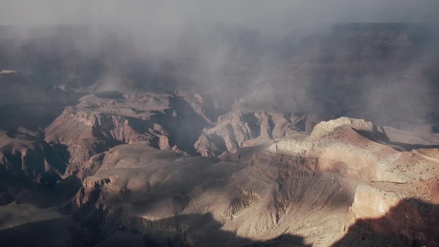 The clouds are touching the top of the mountains