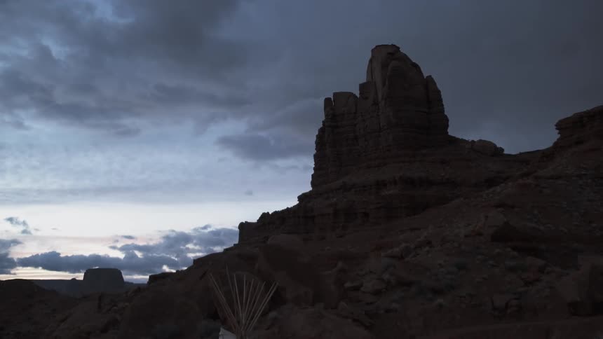 The sun has nearly set behind the canyon