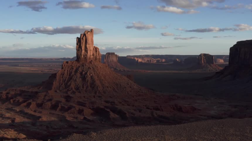 The tall canyons are covered in shadow ahead