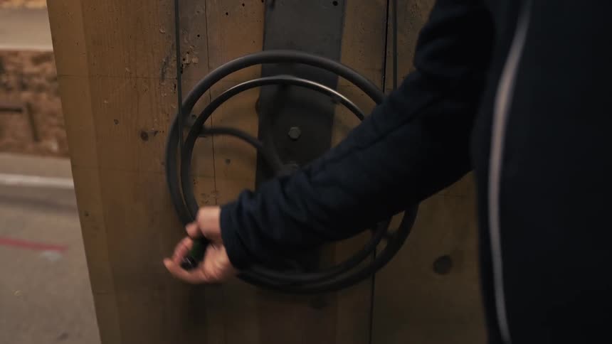 A person turns the wheel slowly