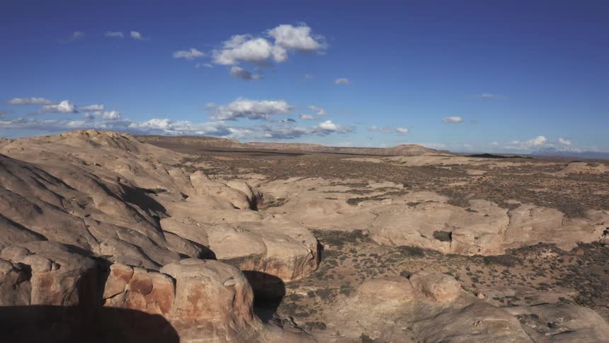 Helicopter sweeping shot of desert plains