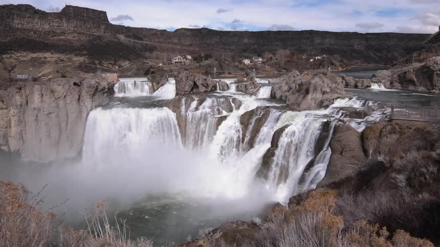 Waterfalls flow over a cliff
