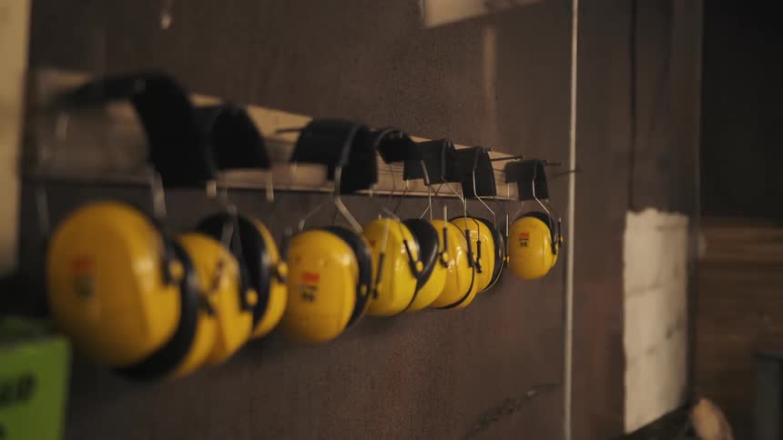 Ear protection devices are hung on the wall