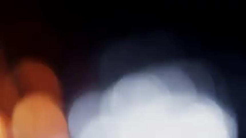 Dark area with blurry lights flashing