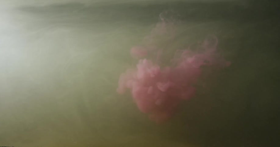 Red liquid suspended in water