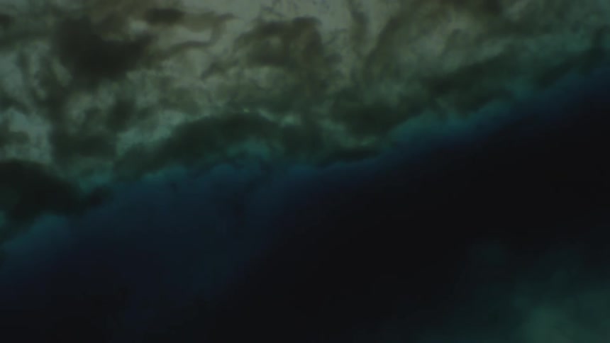 Dark liquid suspended and flowing