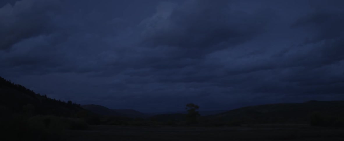 Clouds over a hilly desert landscape