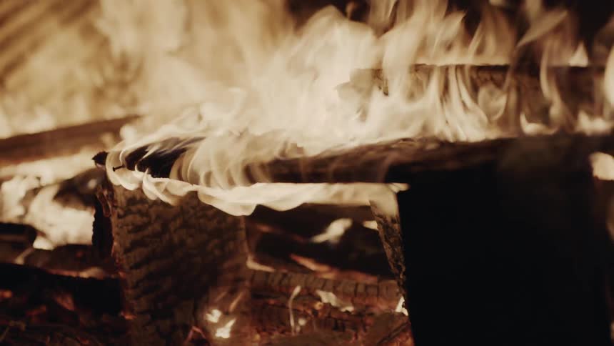 A fire burns pieces of wood
