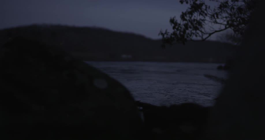 A lake surrounded by hills and rock