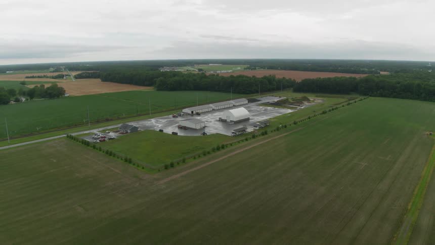 Buildings stand on a rural farm