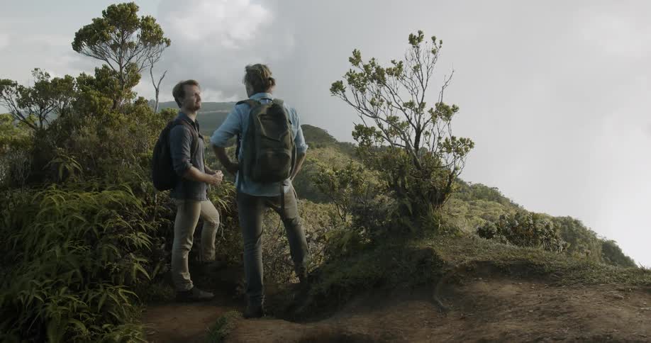 Two men stop to enjoy the view while hiking