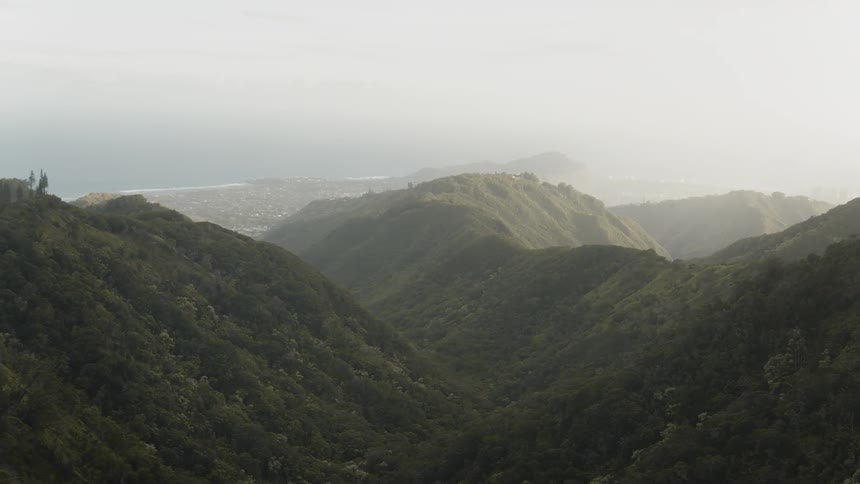 Green mountains on foggy day
