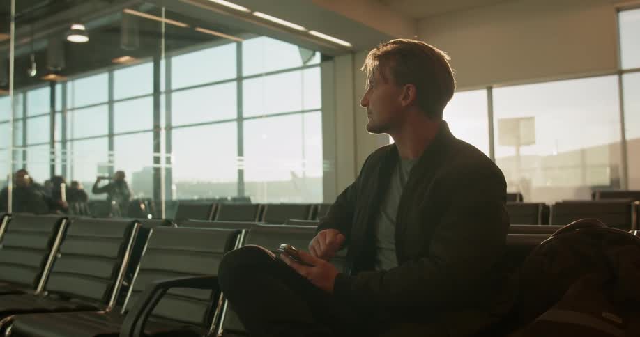 Man sits in airport terminal