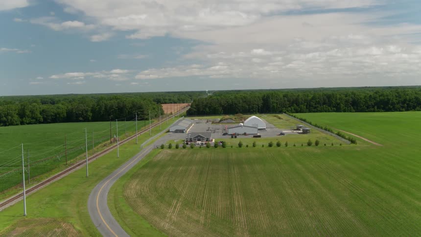 Buildings sit on a rural farm