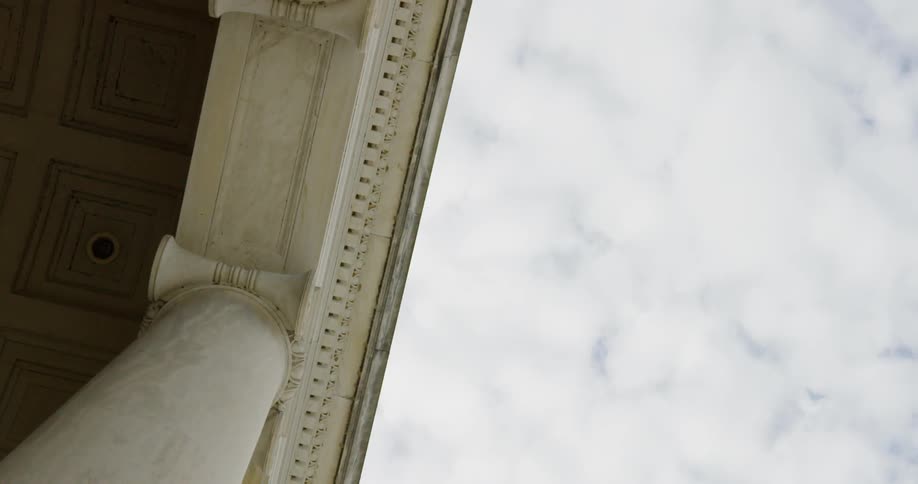 White clouds sit over the building