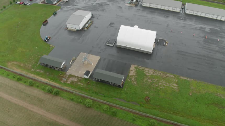 Buildings stand on a rural farm
