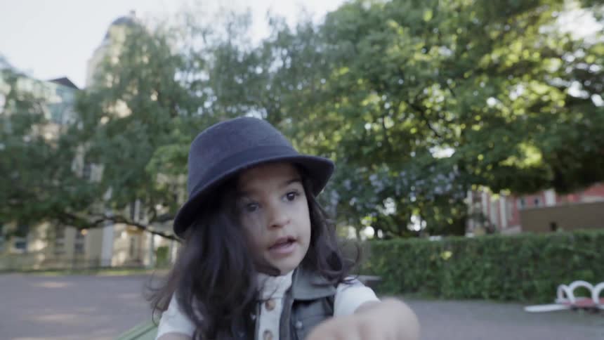 A young child plays in a park