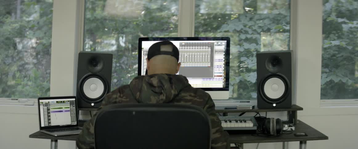 Man records music in a music studio